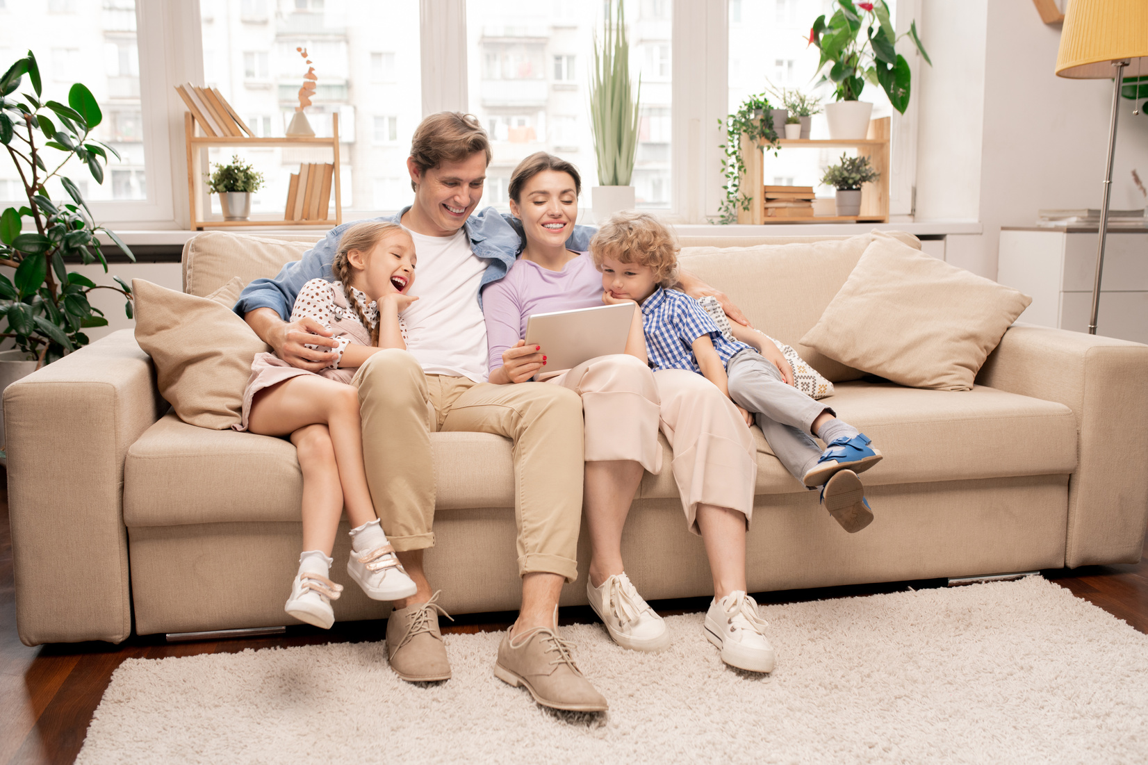 Family Relaxing on Couch in Living-Room